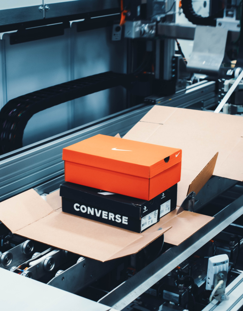 action shot of a box being custom cut to exact size needed for the product